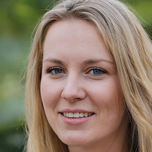 Ava Mitchell, woman with long blond hair, wearing blue shirt