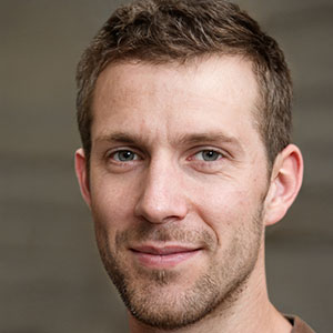 Liam Martinez, bearded man wearing brown shirt