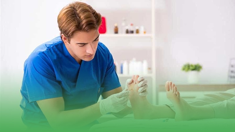 Podiatry business owner examines man's foot