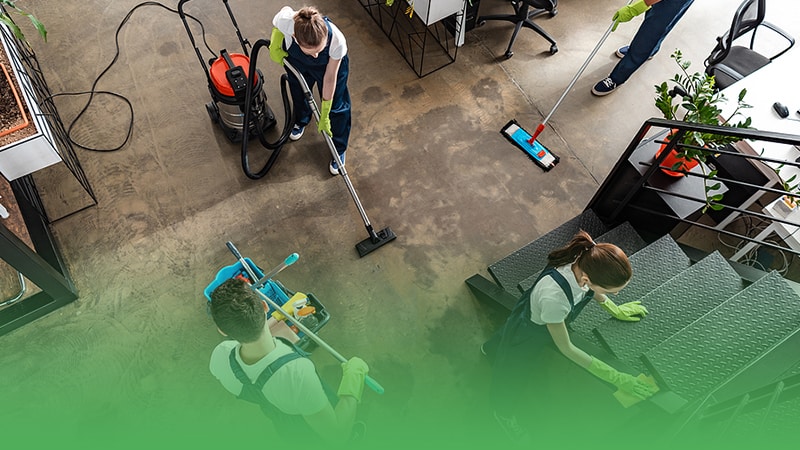 Team of cleaners tidying up room for cleaning service business.